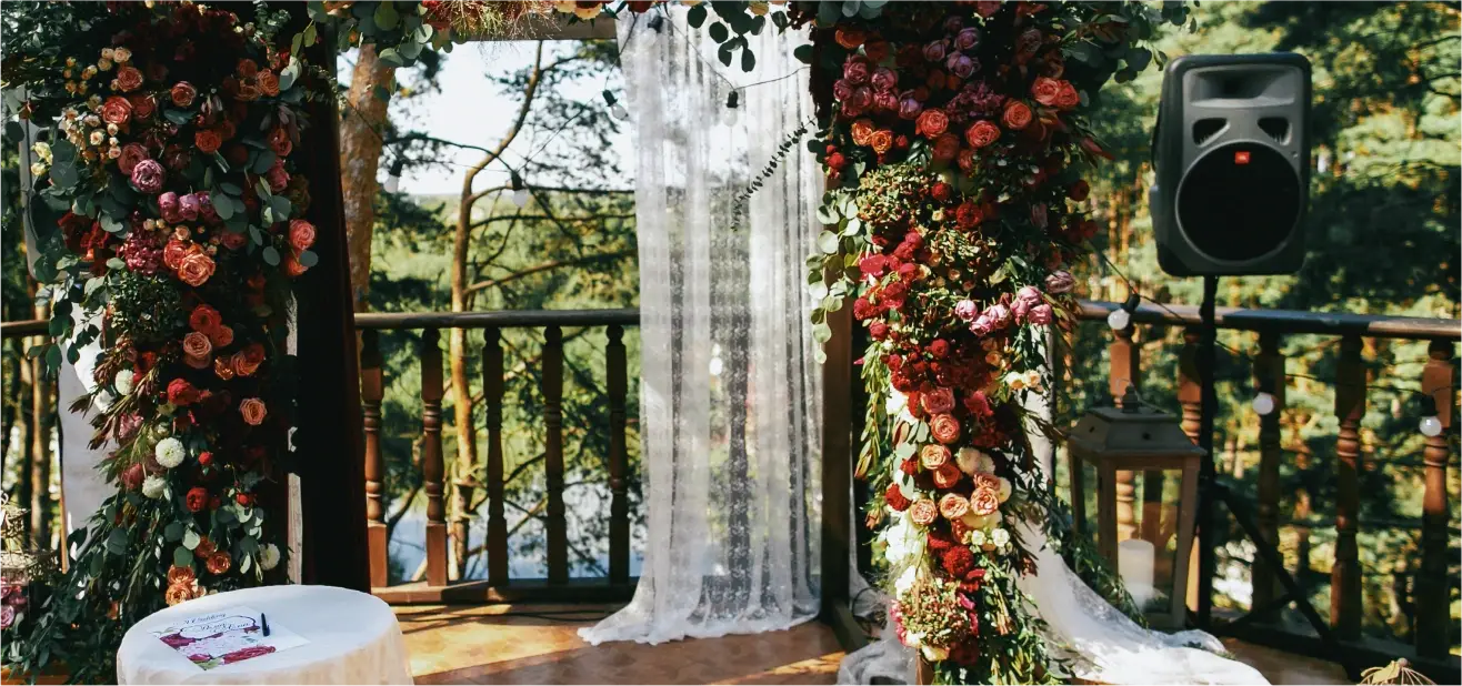 floral wedding altar with white curtains